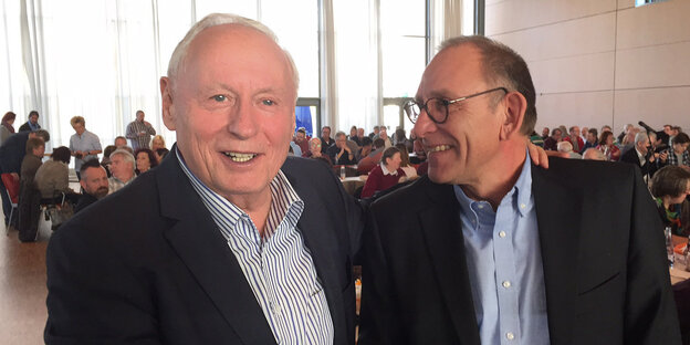Lafontaines und Jochen Flackus lächeln Lafontaines und Jochen Flackus lächeln