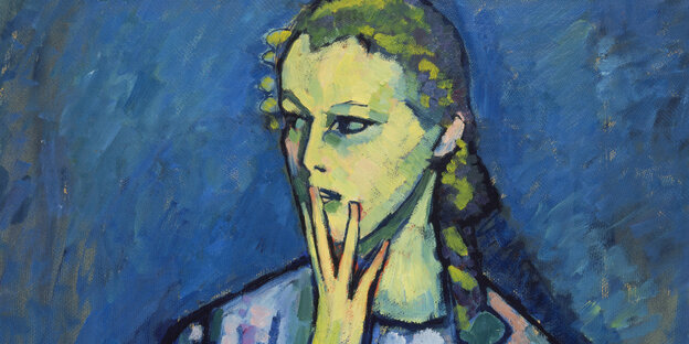 Eine Frau hält sich eine Hand vor den Mund Eine Frau hält sich eine Hand vor den Mund