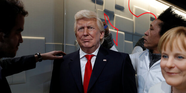 Wachsfiguren von Trump und Merkel