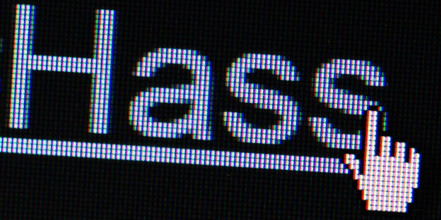 Ein Handsymbol befindet sich auf einem Computerbildschirm vor dem Wort Hass Ein Handsymbol befindet sich auf einem Computerbildschirm vor dem Wort Hass