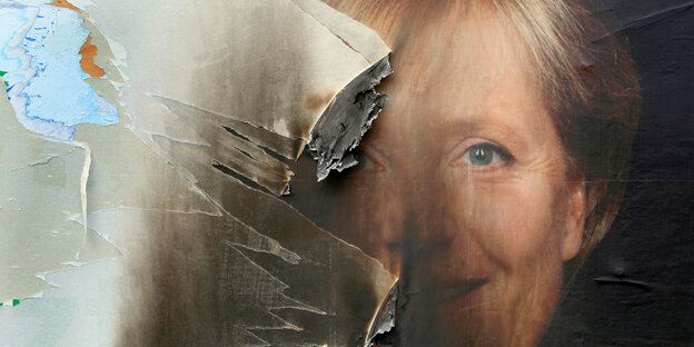 zerrissenes Merkel-Plakat zerrissenes Merkel-Plakat