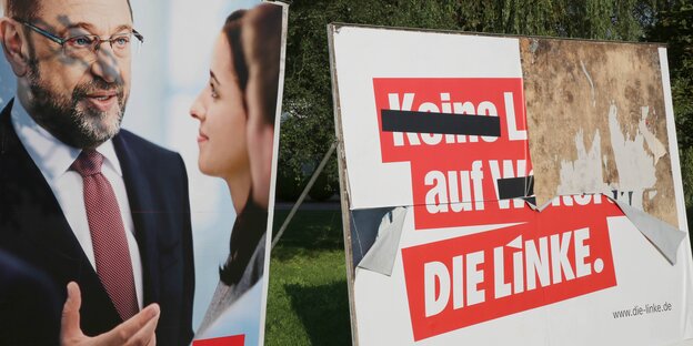 Beschmierte und abgerissene Wahlplakate