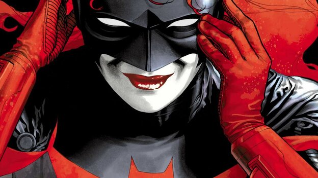 Auf dem Bild ist die Comicfigur Batwoman zu sehen. Sie hat feuerrote Haare und trägt eine Maske Auf dem Bild ist die Comicfigur Batwoman zu sehen. Sie hat feuerrote Haare und trägt eine Maske