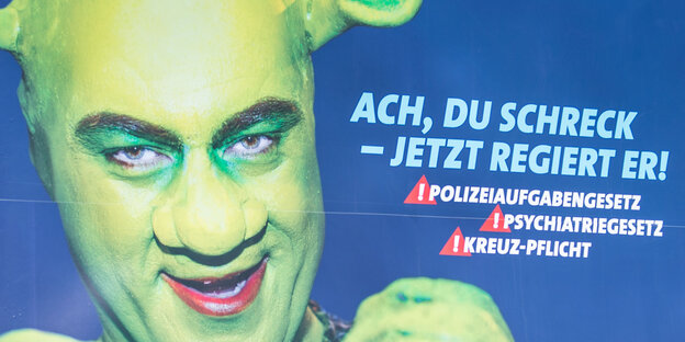 Wahlplakat der bayrischen SPD im Mai 2018. Es zeigt Markus Söder als Shrek als "Ach, du Schreck - jetzt regiert er". Wahlplakat der bayrischen SPD im Mai 2018. Es zeigt Markus Söder als Shrek als "Ach, du Schreck - jetzt regiert er".