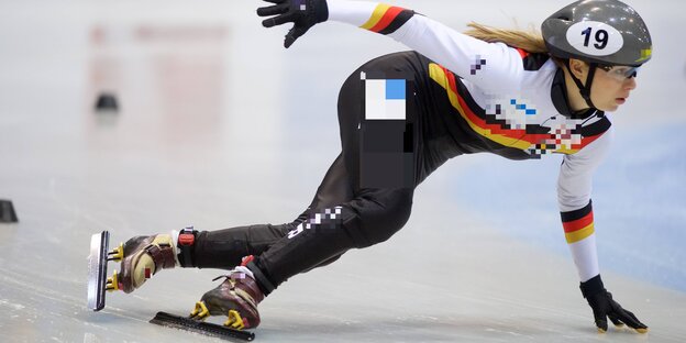 Eisschnellläuferin in der Kurve Eisschnellläuferin in der Kurve