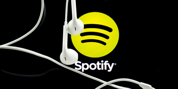 Das Spotify-Logo mit Kopfhörern Das Spotify-Logo mit Kopfhörern