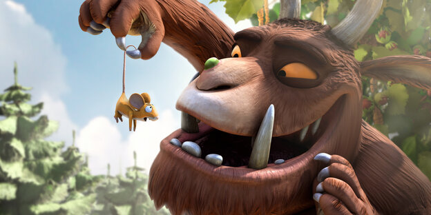 Eine Animation: Grüffelo hält sich eine Maus vors Maul Eine Animation: Grüffelo hält sich eine Maus vors Maul