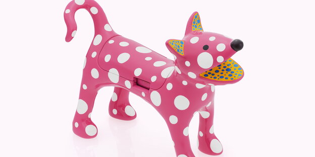Ein pinkfarbener Handyhalter, designt von Yayoi Kusama. Ein pinkfarbener Handyhalter, designt von Yayoi Kusama.