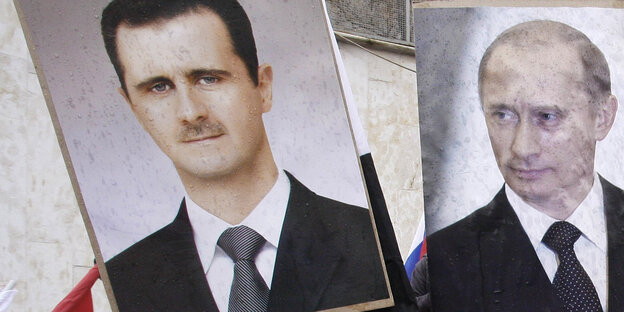 Ein Plakat zeigt Bashar al-Assad und ein Plakat Russlands Präsident Putin Ein Plakat zeigt Bashar al-Assad und ein Plakat Russlands Präsident Putin