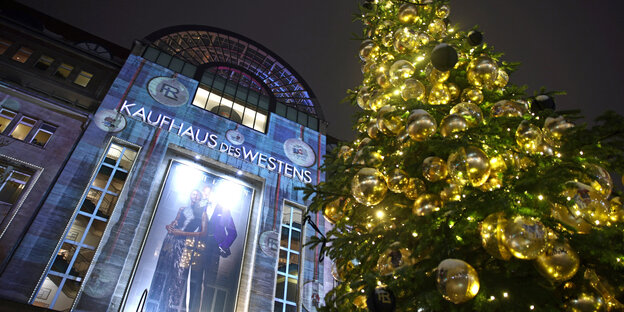 A Christmas tree is set up in front of the department store Kaufhaus des Westens "KaDeWe" in Berlin