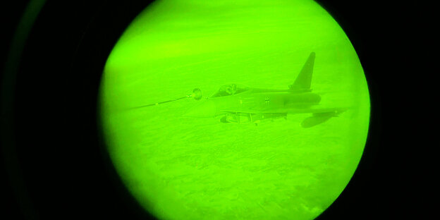 Eurofighter flying seen through a night vision device, showing mid-air refueling
