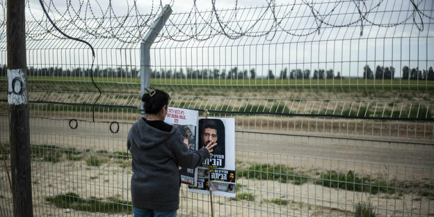 A woman participates in a protest on the Israel-Gaza border organized by the families of Israeli hostages held by Hamas