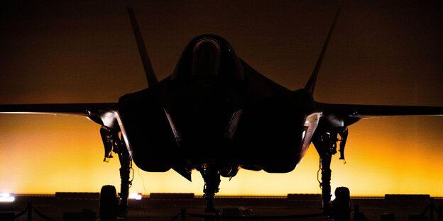 An F-35 fighter jet in the dark.