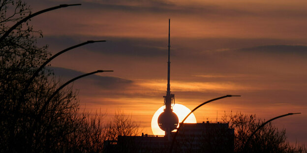 The sun sets behind the Berlin TV tower