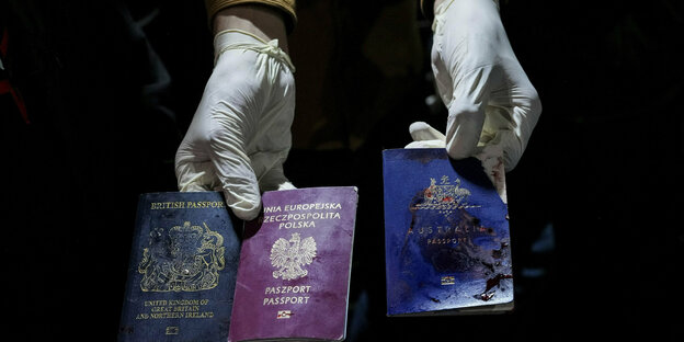 A British, a Polish and an Australian passport with blood