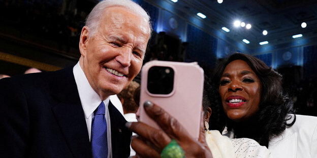 Joe Biden poses for a selfie.