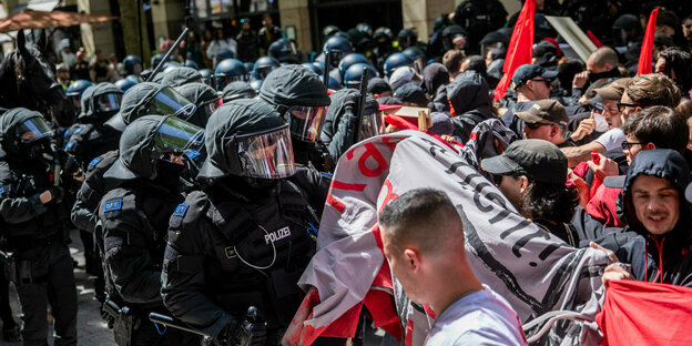Police units clash with protesters during the May 1 revolutionary demonstration in the center of Stuttgart.
