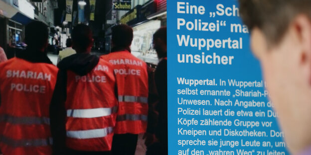 Ein Mann liest online einen Artikel zur "Shariah Police" Ein Mann liest online einen Artikel zur "Shariah Police"