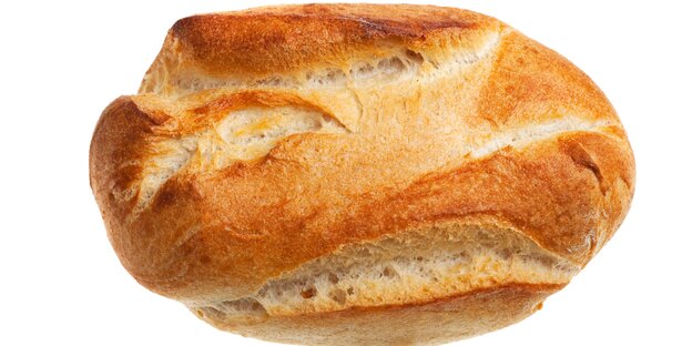 Ein Dinkelbrötchen von oben vor weißem Hintergrund Ein Dinkelbrötchen von oben vor weißem Hintergrund