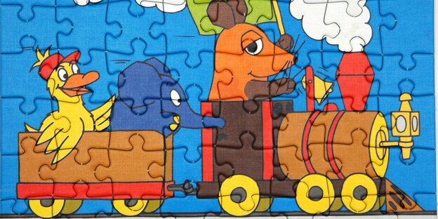 ein Puzzle mit einem Motiv aus der „Sendung mit der Maus“ ein Puzzle mit einem Motiv aus der „Sendung mit der Maus“