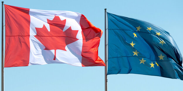 Die kanadische und die EU-Flagge wehen im Wind Die kanadische und die EU-Flagge wehen im Wind