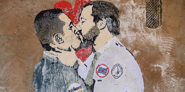 Ein Grafitto zweier sich klüssender Männer Ein Grafitto zweier sich klüssender Männer