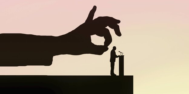 Eine Hand setzt zum Schnipsen hinter einem POlitiker an Eine Hand setzt zum Schnipsen hinter einem POlitiker an