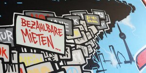 Graffiti an einer Häuserwand mit der Aufschrift "bezahlbare Mieten" Graffiti an einer Häuserwand mit der Aufschrift "bezahlbare Mieten"