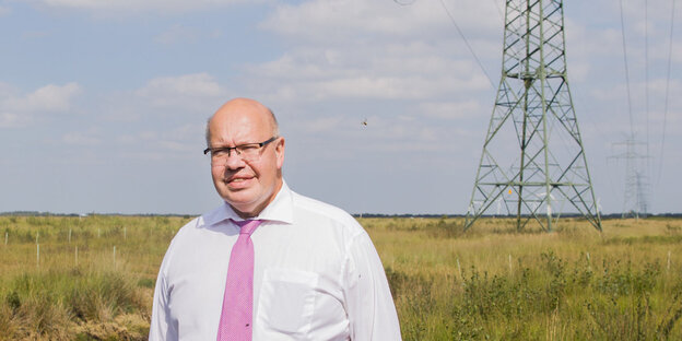 Peter Altmaier mit Stromtrasse Peter Altmaier mit Stromtrasse