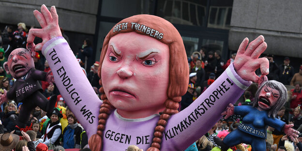 Ein Mottowagen beim Karneval bildet die schwedische Klimaaktivistin Greta Thunberg ab. Ein Mottowagen beim Karneval bildet die schwedische Klimaaktivistin Greta Thunberg ab.