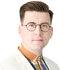 Sebastian Tynkkynen, ein Mann mit kurzen dunklen Haaren, Brille und ohne Bart Sebastian Tynkkynen, ein Mann mit kurzen dunklen Haaren, Brille und ohne Bart