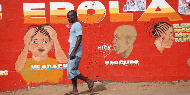 Mauer mit Aufklärungs-Wandbild zu Ebola Mauer mit Aufklärungs-Wandbild zu Ebola