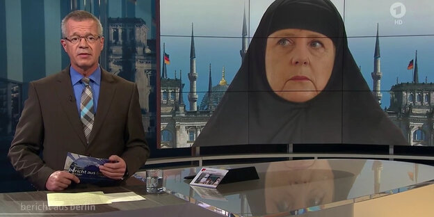 Ein Ausschnitt aus dem "Bericht aus Berlin", der Merkel mit Kopftuch zeigt. Ein Ausschnitt aus dem "Bericht aus Berlin", der Merkel mit Kopftuch zeigt.