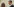 Frau mit lockigen Haaren und Mann mit Brille und kurzen Haaren lachen sich an - es sind die mutmaßliche Rechtsterroristin Beate Zschäpe und ihr Verteidiger Mathias Grasel
